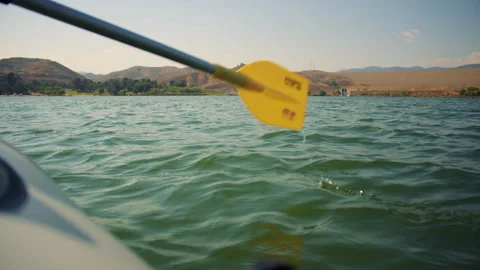 First person view of rowing a boat across calm evening lake. Sailing a boat 스톡 동영상 285807279