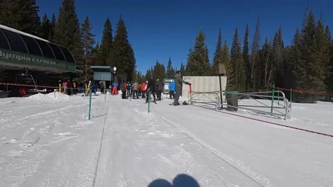 First Person View sit skier Entering Accessible Queue for Ski Lift Stock Footage 216819672