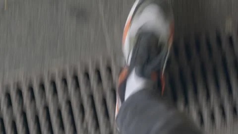 First-person view stepping over yellow line on train platform 動画素材 347203098