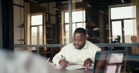 First person view: two black businessmen in white shirts working in the office Stock Footage 246417276
