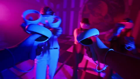 First person view of using virtual reality VR equipment on an arena. Team of Stock Footage 245786650