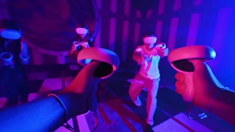 First person view of using virtual reality VR equipment on an arena. Team of Stock Footage 245786766