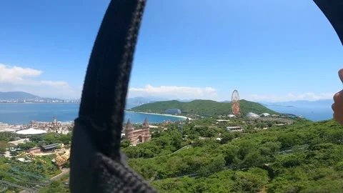 First person view View on a zipline in Vinpearl Amusement Park, Vietnam Stock Footage 321623656