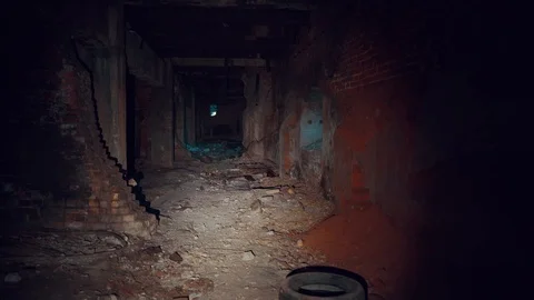 First-person view, walk with flashlight through dark creepy industrial tunnel or Stock Footage 121538445