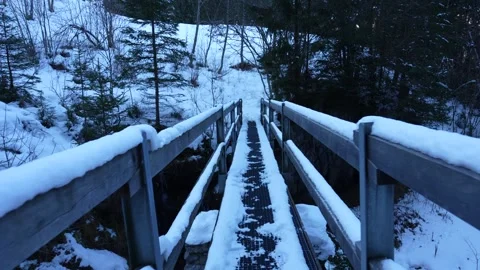 First person view walking across snowy bridge in winter forest ugc Stock-Footage 328374940