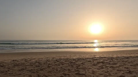First-person view walking on beach sand at sunset Stock Footage 332064994