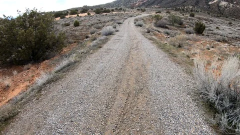 First person view walking down gravel road. Stock Footage 105143172