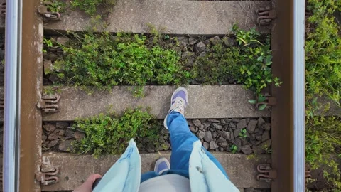 First person view walking on old railroad tracks Stock Footage 338164010