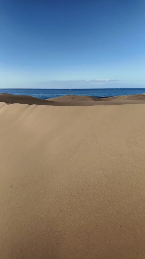 First person view walking on sand dunes towards the ocean Stock Footage 346177710