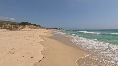 First-person view walking on the seashore sand of a paradisiacal beach Stock Footage 332074215
