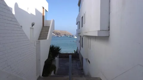 First person view walking through a narrow passage to reach the open sea with 库存影片 155819383