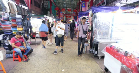 First person view walking through rather busy Petaling market Stock Footage 319636829