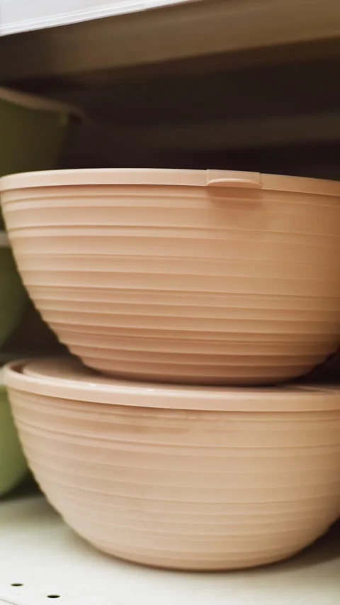 First-Person View of Well-Arranged Bowls in Different Sizes and Colors on Stock Footage 316501021
