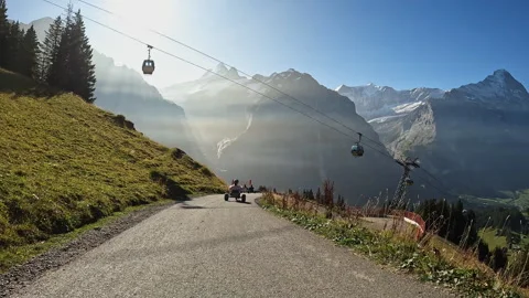 First person view while riding mountain carts on tail in Switzerland Stock Footage 255409940