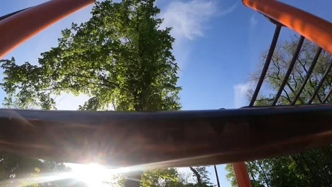 First-person view. Workout. A man pulls himself up on a horizontal bar in park Stock Footage 241414336