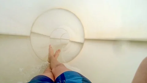 First person view of a young man sliding in a tunnel water slide - video HD Video stock 106064087