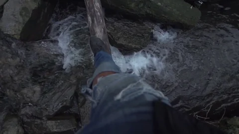First Person Walking Across River On Log Stock Footage 79736543