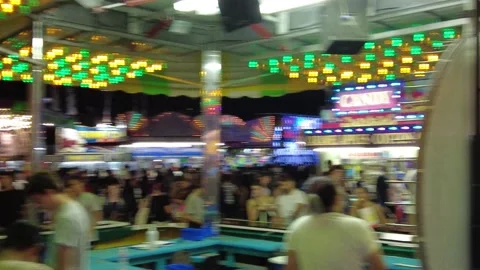 First Person Walking Through Amusement Park Crowds At Night Stock Footage 223918735