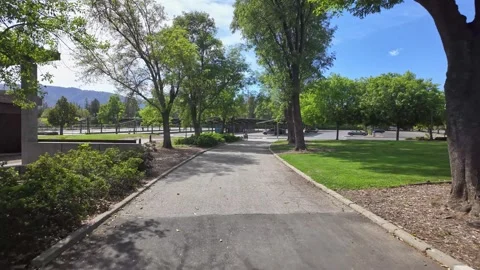 First-person walking tour on a pathway at West Valley College campus Stockbeeldmateriaal 332644196