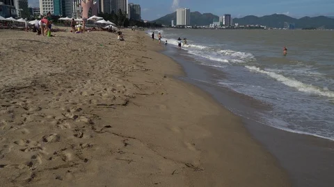 The first person's perspective, who walks along the beach, looks at the sea a Stock Footage 106384310