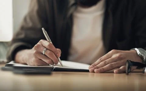 First plan, then pull it off. an unrecognisable businessman writing in a Stock Photos