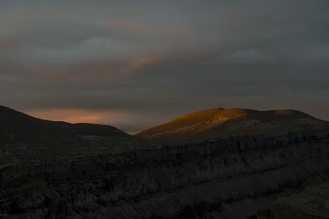 The first rays of light appearing in a cloudy morning Stock Photos