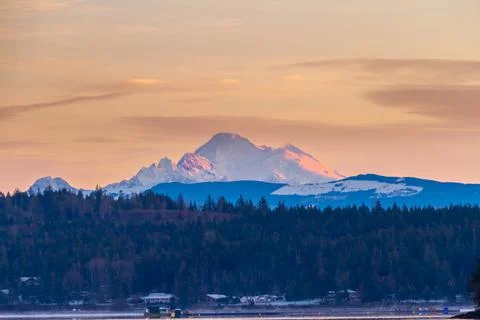 The first rays of light hitting Mt Baker 写真素材