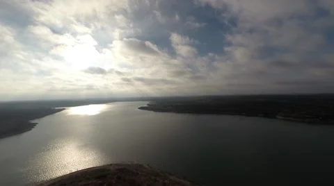 First rays of sun coming up over the lake Video stock 46729332