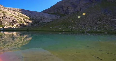 First rays of sun on lake Paione 스톡 동영상 339400158