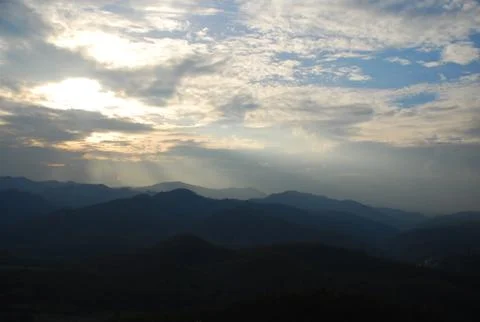 The first rays of the sun light up Stock Photos