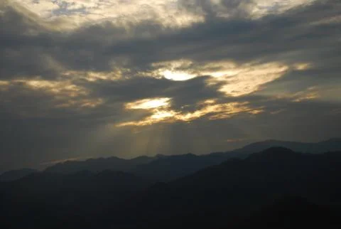 The first rays of the sun light up Stock Photos
