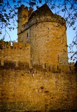 The first rays of sunlight glance across the walls and turrets in Carcassonne Stock Photos