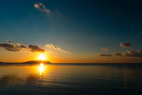 First rays of sunlight over the Trans Sea Island. Stock Photos