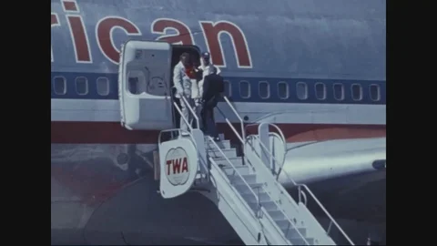 First refugees to disembark from A/C with State Policeman - 1975 Stock Footage 97904484