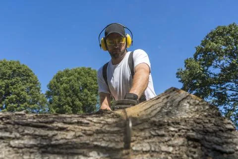 A First Responder Cuts Down A Tree After It Was Blown Over During A Severe St Stock Photos