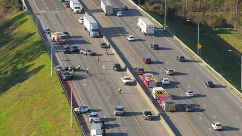 First responders at car accident site in Florida. Emergency services personnel Stock Footage 317643345