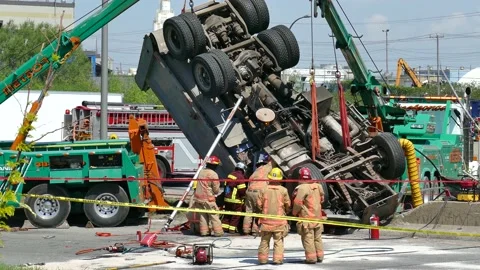 First responders getting victim out of truck in a spectacular physical rescue Stock Footage 133268970