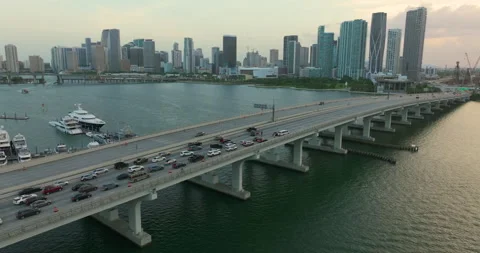 First responders help at vehicle collision on bridge road. Car crash in Miami Stock Footage 258410395