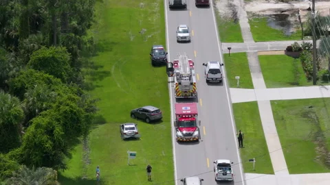 First responders responding to car accident site on American street. Emergency Stock Footage 317643502