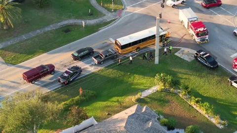 First responders responding to school bus and car accident site on American Stock Footage 314801863
