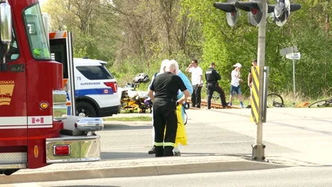 First responders taking off covid-19 bio hazard protective body suit at incident Video stock 133973124