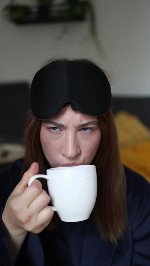 First sip of coffee instantly brightens a sleepy morning mood Stock-Footage 340087547