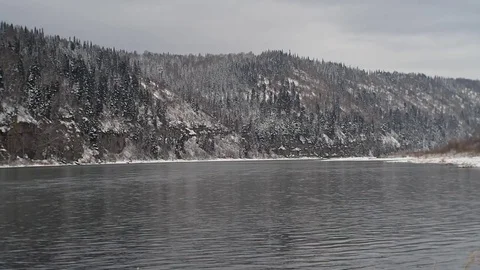 First snow in the autumn forest by the river. Stock Footage 82220735