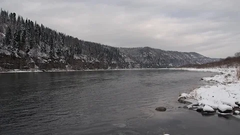 First snow in the autumn forest by the river. Stock Footage 82220746