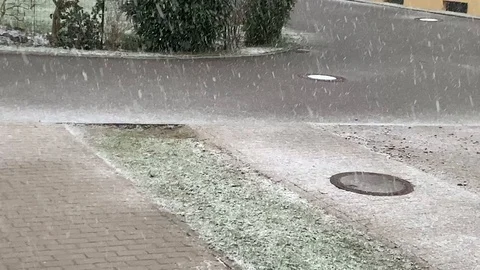 First snow falling on still green grass Stock Footage 104795573