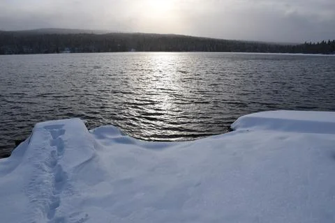 The first snow on the lake in the fall Stock Photos