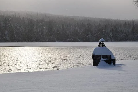 The first snow on the lake in the fall Stock Photos