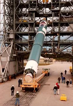 The first stage of a Boeing Delta II rocket is lifted to its vertical posi... Stock Photos