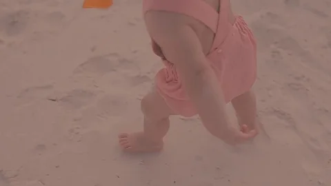 A first step of baby at the sand beach. A little girl walks the sand 스톡 동영상 73909664