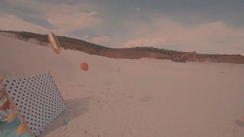 A first step of baby at the sand beach. A little girl walks the sand Stockbeeldmateriaal 73909686